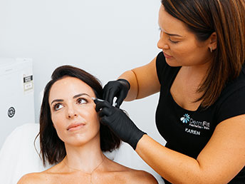 Karen Wescott performing injectable treatment